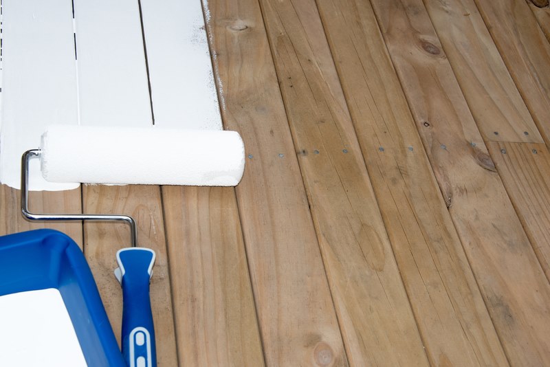 Primer being applied to wooden floor