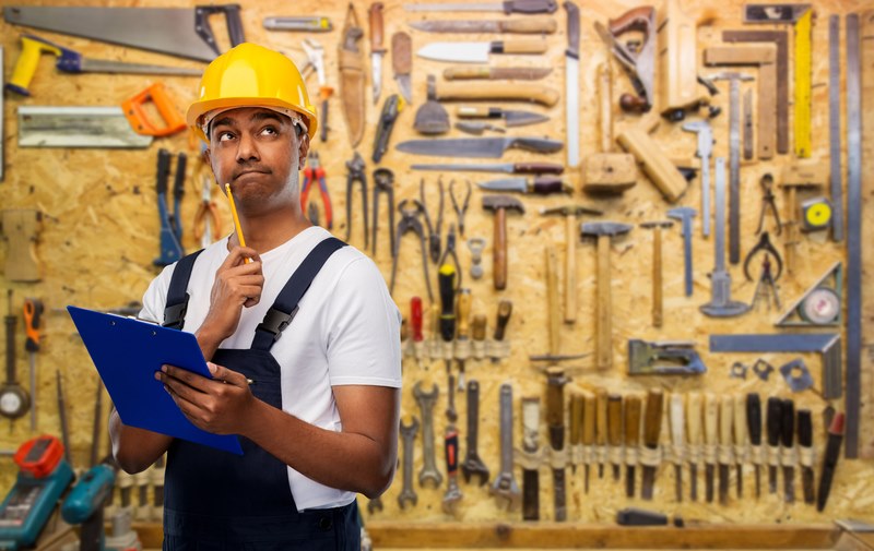 man thinking about which floor sander to use