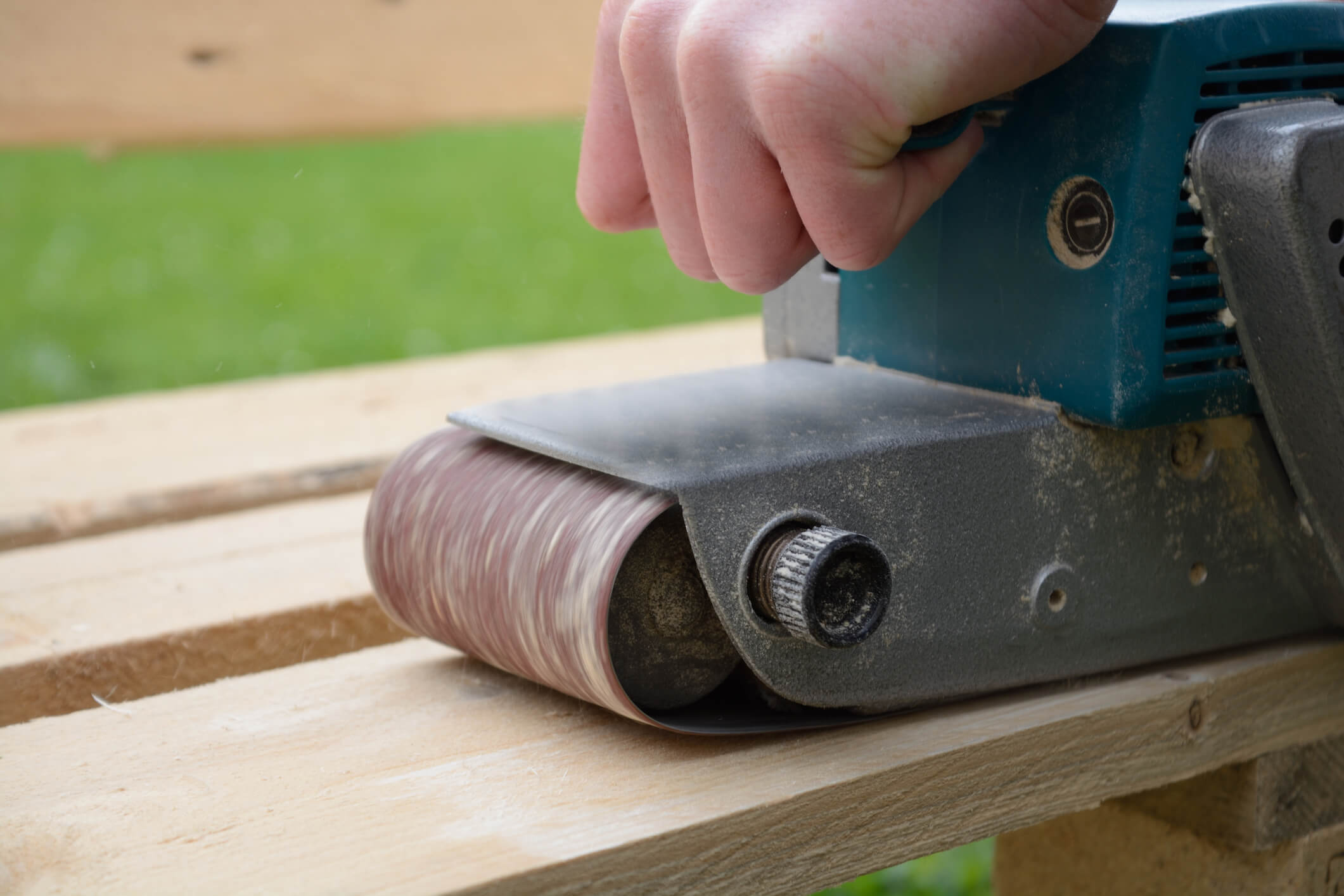 Sander on wood outside